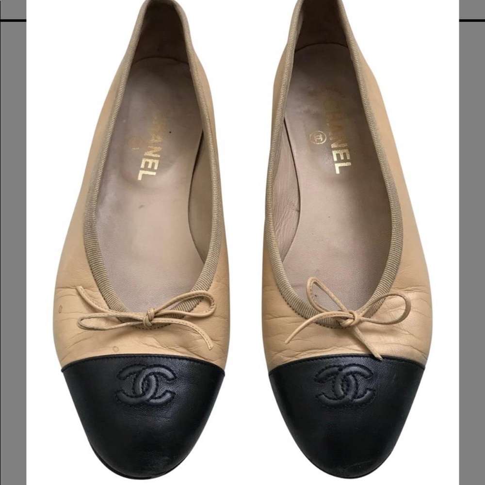 Classic Chanel tan and black ballet flats